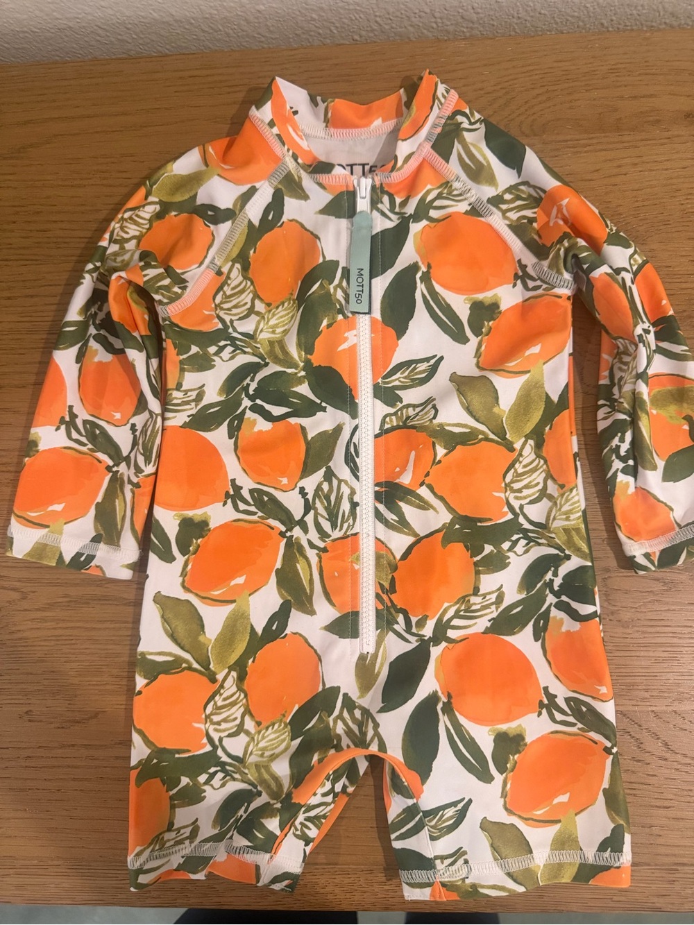 Mott50 White and Orange Infant Rash Guard